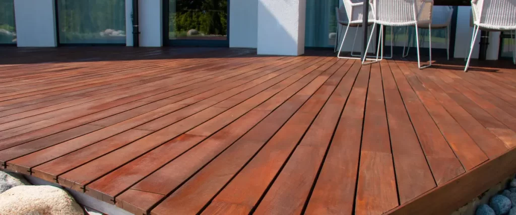 Close-up of newly stained wooden deck boards.