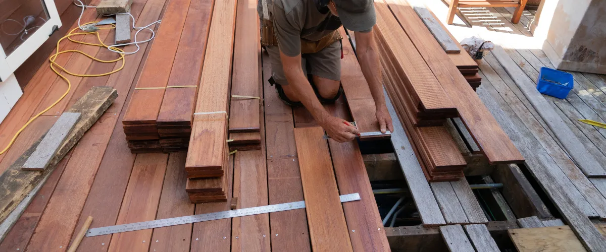 a worker doing deck building services in Lawrence IN